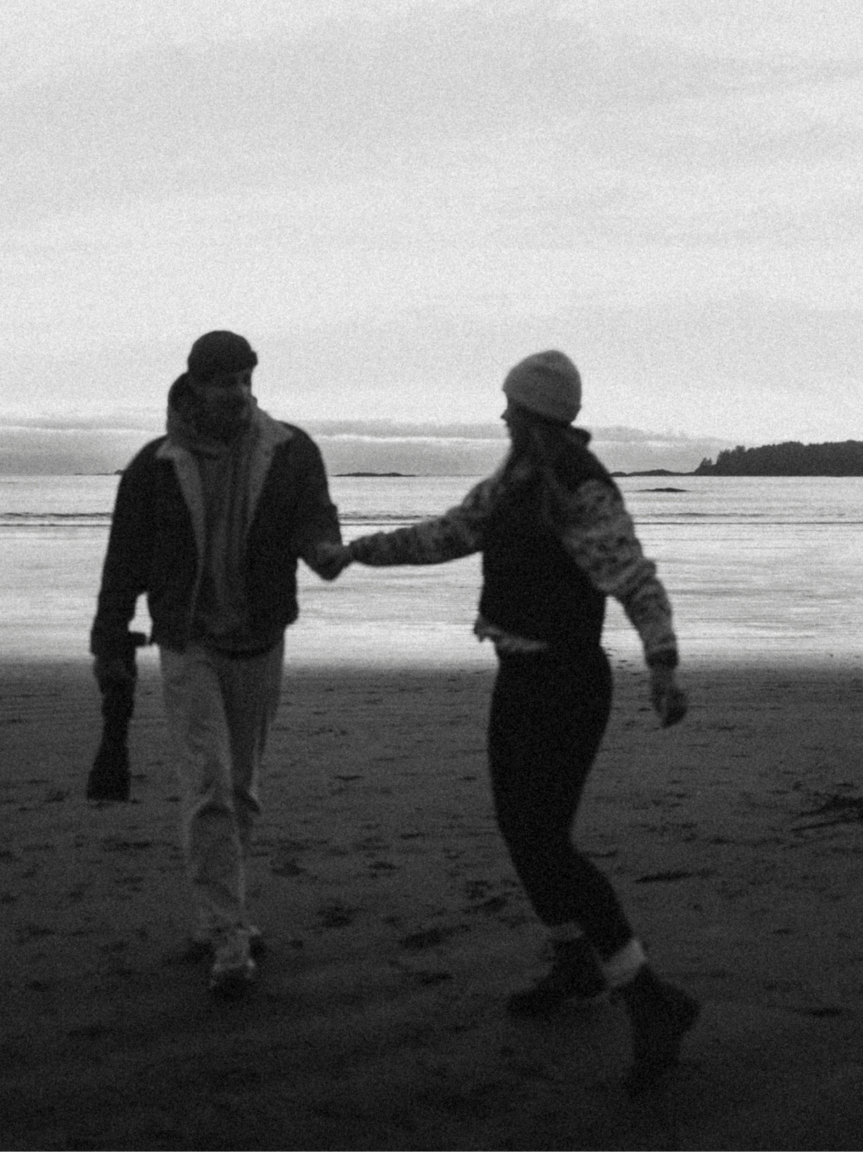 A grainy black and white beach photograph